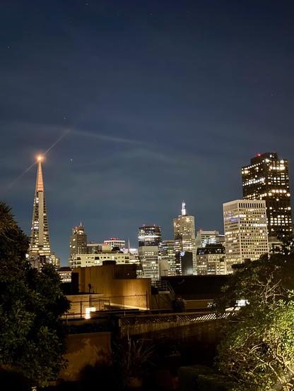 View from Nob Hill, San Francisco, to the East towards the financial district at night -Transamerica pyramid on the left lit up orange on the top.