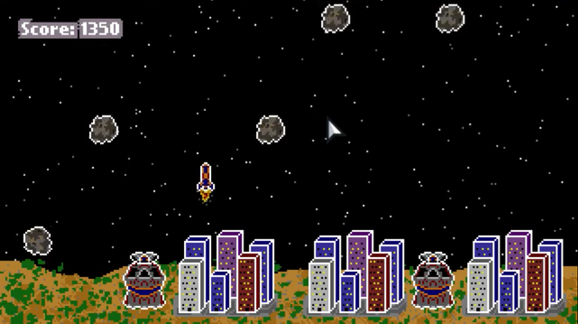 Screenshot of a retro style game, Meteor Defense. The image features several cities and missile towers on a green and brown landscape, a starry background, several meteors are falling to the ground and missile is launched toward the missiles. The score has a value of 1350.