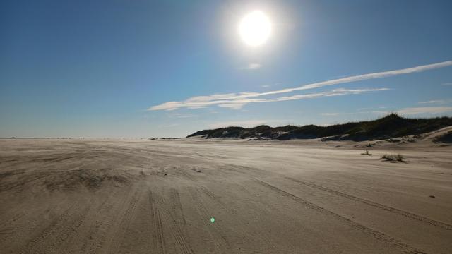Wind blowing across the open sand expanse of the OBX