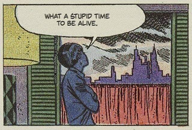 A single panel from a retro-style comic. It shows a person in silhouette, with arms crossed, looking out a window at a dark city skyline. A speech bubble from the person says, "WHAT A STUPID TIME TO BE ALIVE."