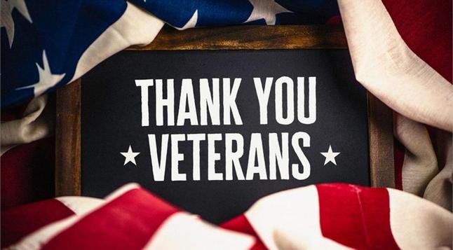 Image says, “Thank you Veterans”, with parts of the American flag in view. 