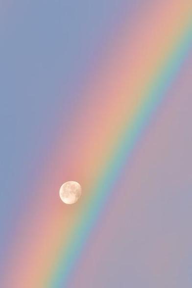  The moon perfectly framed by a rainbow closer.
