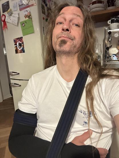 Marc, organiser of beyond tellerrand, wearing a sling on his right arm.