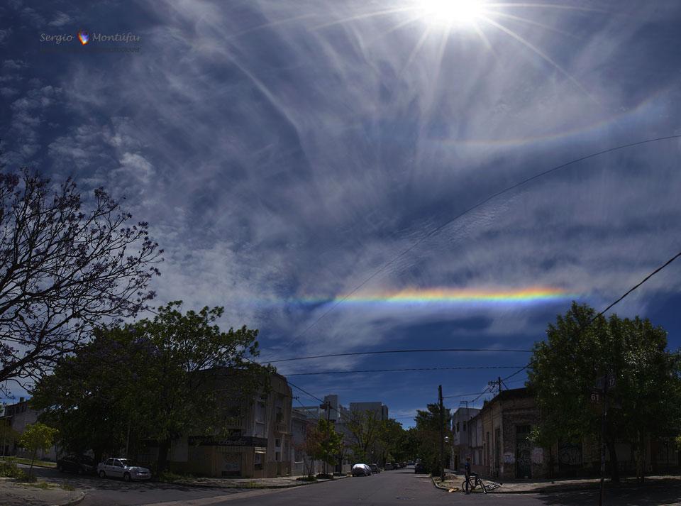 More unusual, though, is the bottom color arc. Sometimes called a fire rainbow, this circumhorizon arc is also created by ice, not fire nor even rain. Here, a series of horizontal, thin, flat ice crystals in high cirrus clouds refract sunlight between the side and bottom faces toward the observer. These arcs only occur when the Sun is higher than 58 degrees above the horizon. The featured sky occurred to the northwest in the early afternoon last month over a street Diagonal of La Plata City, Buenos Aires, Argentina.
Image Credit & Copyright: Sergio Mont�far (Planetario Ciudad de La Plata, pna)