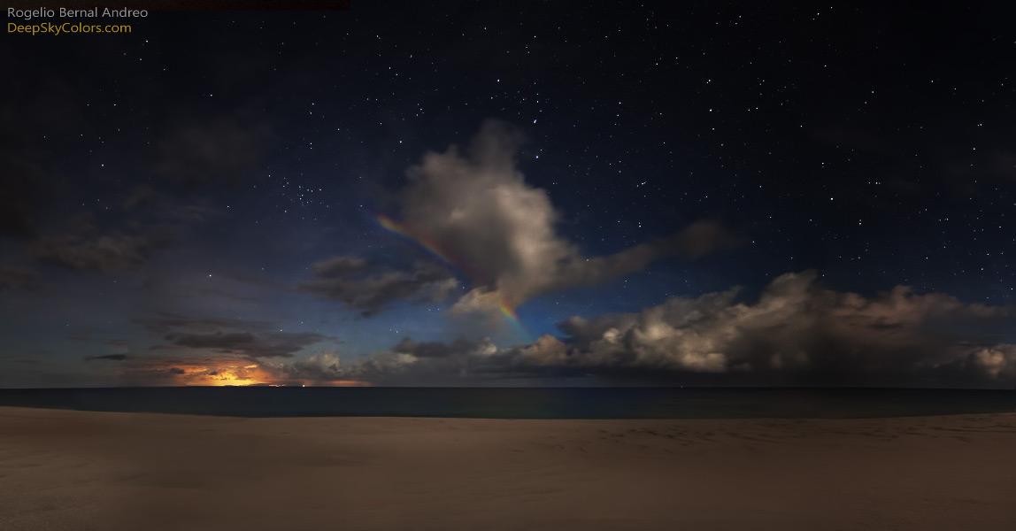 So where was the Moon? A rainbow is produced by sunlight internally reflected in rain drops from the direction opposite the Sun back toward the observer. As the light passes from air to water and back to air again, longer wavelengths are refracted (bent) less than shorter ones resulting in the separation of colors. And so the moonbow is produced as raindrops reflect moonlight from the direction opposite the Moon. That puts the Moon directly behind the photographer, still low and rising over the eastern horizon, a few days past its full phase.
Image Credit & Copyright: Rogelio Bernal Andreo (Deep Sky Colors)