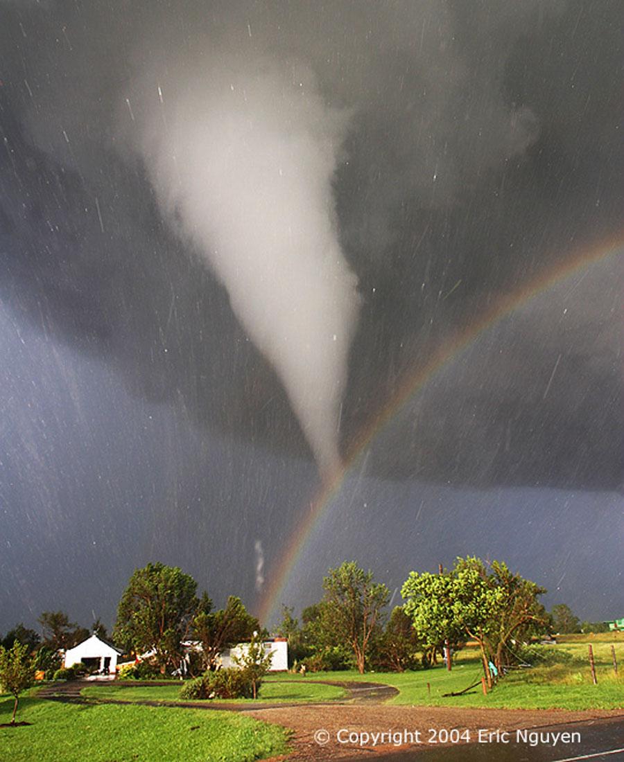 The Sun, peeking through a clear patch of sky to the left, illuminates some buildings in the foreground. Sunlight reflects off raindrops to form a rainbow. By coincidence, the tornado appears to end right over the rainbow. Streaks in the image are hail being swept about by the high swirling winds. Over 1,000 tornadoes, the most violent type of storm known, occur on Earth every year, many in tornado alley.
Image Credit & Copyright: Eric Nguyen (Oklahoma U.), www.mesoscale.ws