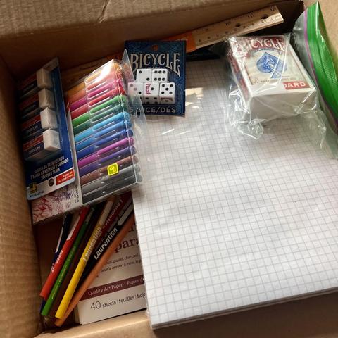 Erasers, graph paper, felt pens, coloured pencils, dice, playing cards, and a sketch pad.