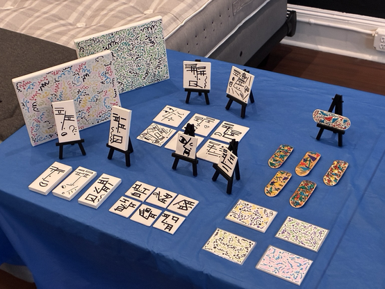 Array of mini canvases, fingerboards, and art cards made by Katterhaus.