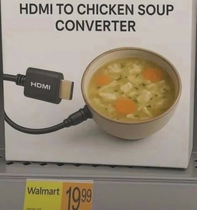 A surreal image of what appears to be a product box on a store shelf, likely at Walmart, as indicated by a yellow price tag showing "$19.99". The box is labeled "HDMI TO CHICKEN SOUP CONVERTER". The image on the box shows an HDMI cable plugged directly into the side of a ceramic bowl filled with chicken noodle soup.