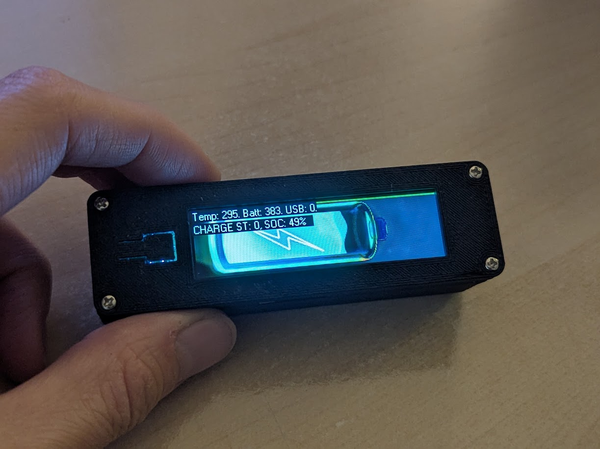 a 3d printed case with a small color LCD panel slightly larger than an AA battery.
