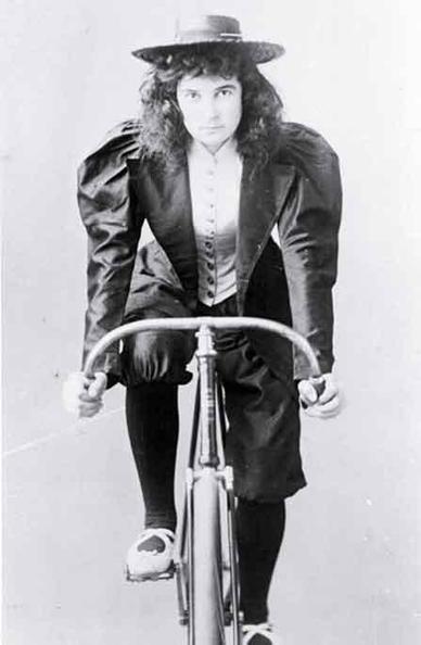 1880s woman riding her bicycle 