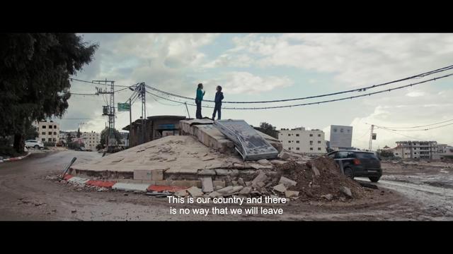 A screenshot from State of Rage.
One girl says to another:
"This is our country and there is no way that we will leave."