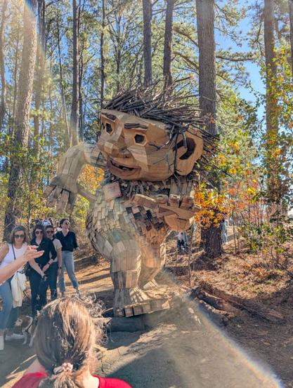 A 12 feet wood sculpture of a troll