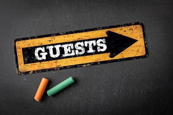 Direction arrow with text on a dark chalkboard.