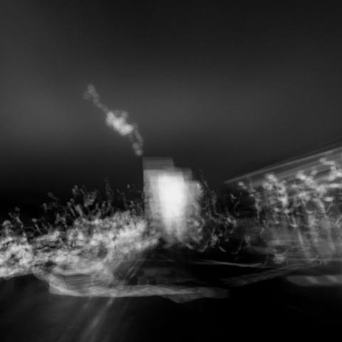 Dark and moody, black-and-white urban landscape photograph with hand-held lens distortion 

Photography by Al Keddie