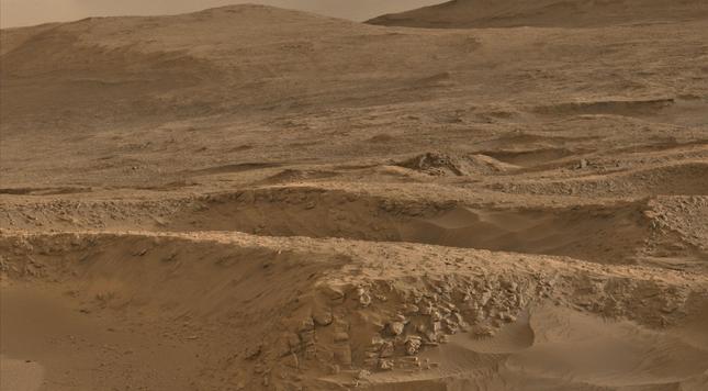 An ochre toned photography of a Martian landscape.