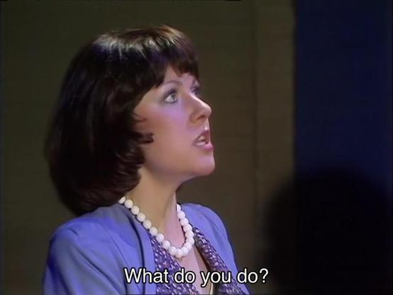 Tom Baker episode. (Aren’t they all?) Sarah Jane Smith is standing in a dark concrete industrial looking basement, with an exceptionally British man in a tweed coat and another woman just off-screen. Sarah’s got a lovely purple outfit with a white necklace. Oh, and there’s a giant metal robot standing in the room, too. Sarah asks, “What do you do?” The robot replies, “Insufficient data.” Typical.