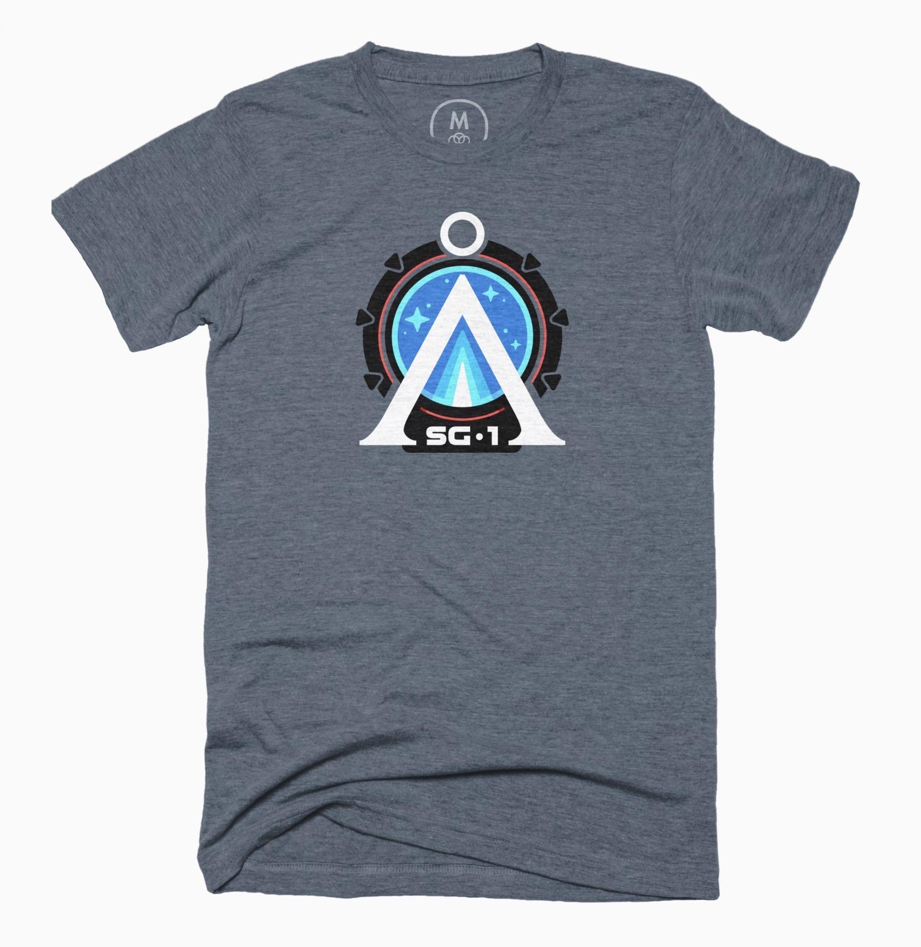 Grey heather t-shirt with a bold graphic design of the Stargate with a white gate symbol for earth at the center and SG-1 at the bottom.