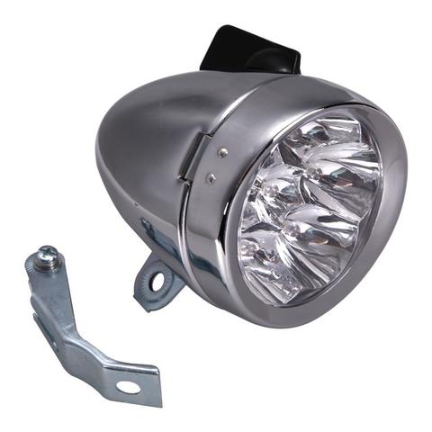 Bild einer vintage Fahrradlampe, verchromt, mit aufgesetztem, schwarzen Drehschalter. Links neben der Lampe liegt ein Befestigungselement.