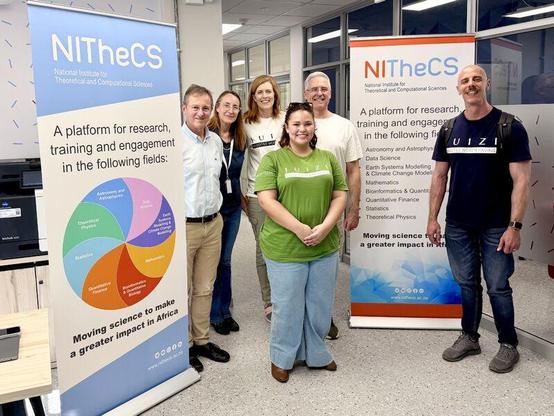 Team Juizi and Team NITheCS standing infront of NITheCS banners.