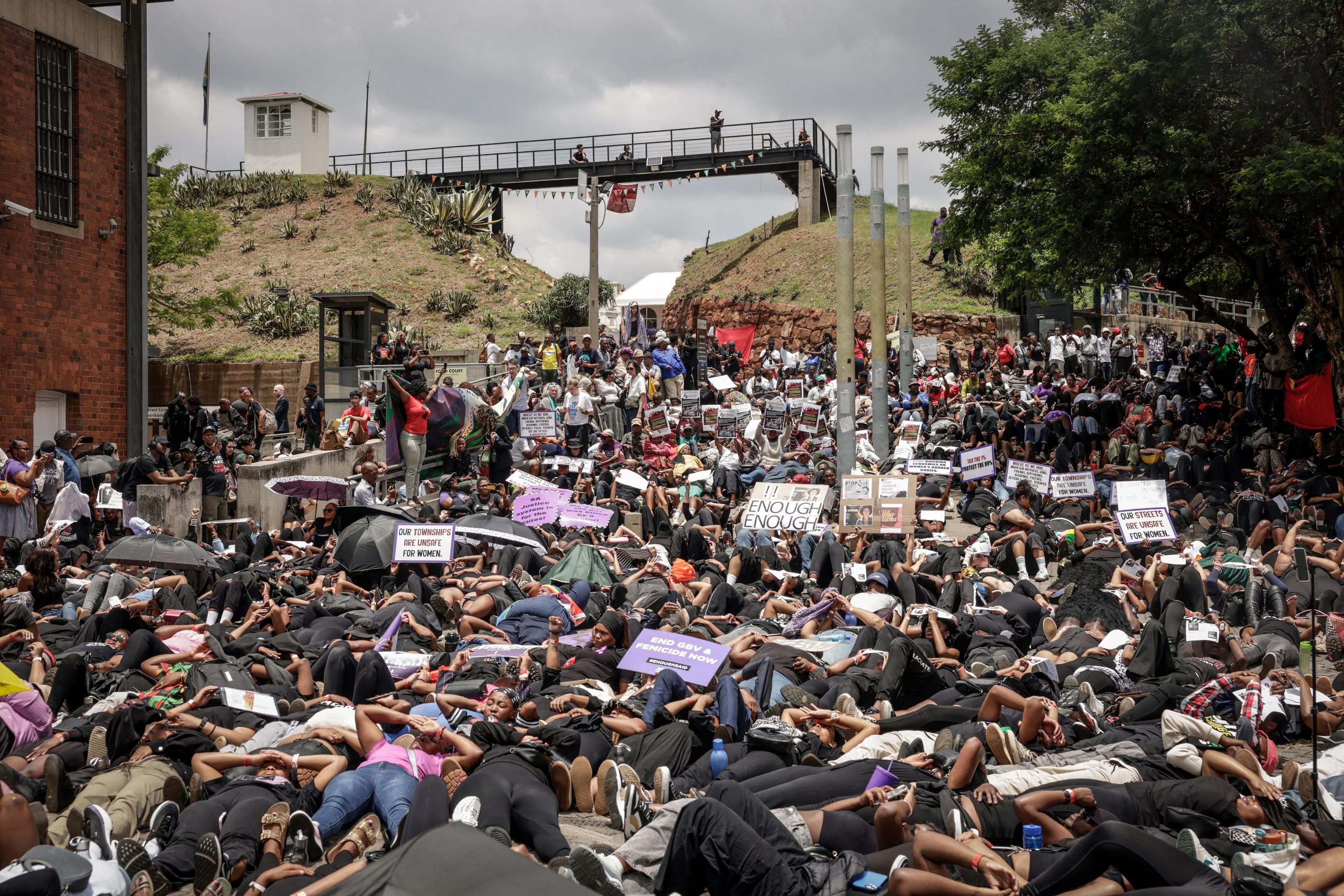 Women lie on the ground during the women’s nationwide shutdown ahead of the G20 summit.