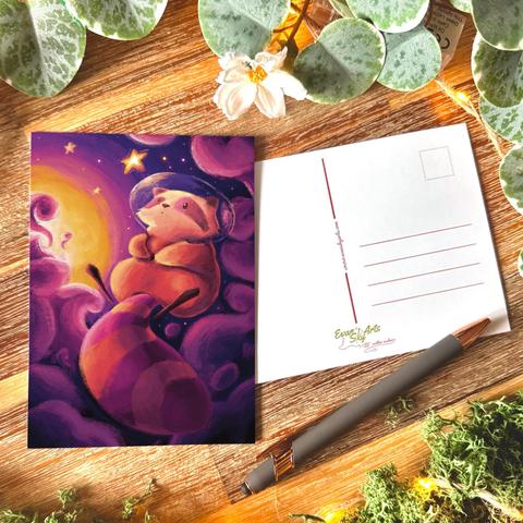 Picture of a postcard featuring a digital illustration of a little orange and purple raccoon floating in space, looking at a little star that’s shining above him. His head is surrounded with a thin protective bubble. The raccoon is surrounded with swirly purple cloud, a sun shining in the distance.