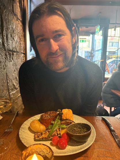Keith presenting his vegan stake dinner 