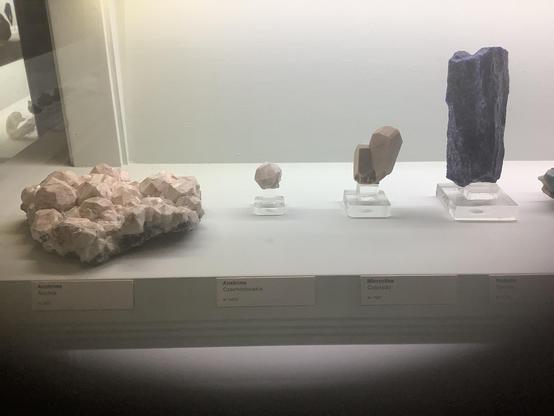 #Analcime (/əˈnælsiːm, -saɪm/; from Ancient Greek ἀνάλκιμος (análkimos) 'not strong') or analcite is a white, gray, or colorless tectosilicate mineral. Analcime consists of hydrated sodium