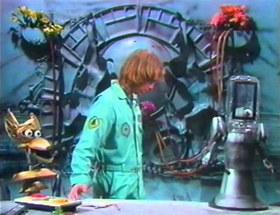 Still from the first ever MST3K Experiment 
Crow, Joel, and Beeper are on the bridge of the Satellite of Love