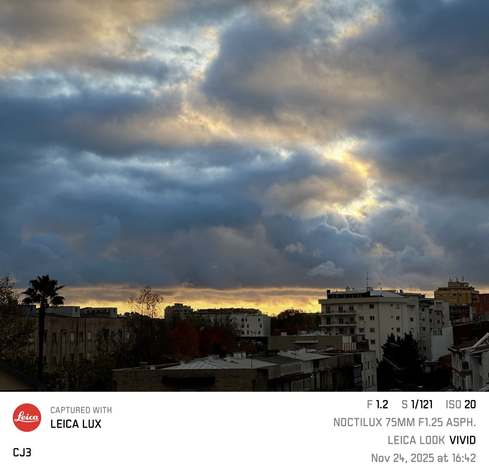 Sun setting behind large cumulus clouds. 