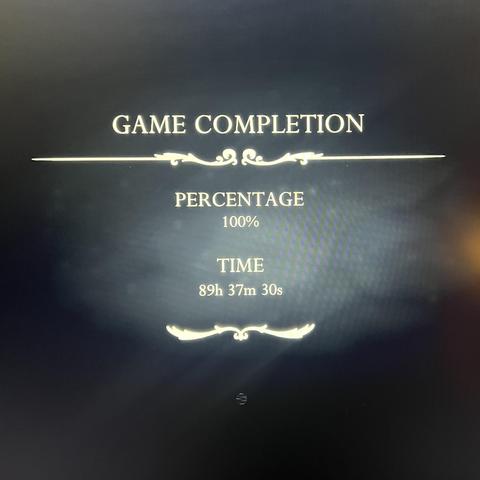 Photograph of a screen showing:

GAME COMPLETION
PERCENTAGE
100%
TIME
89h 37m 30s