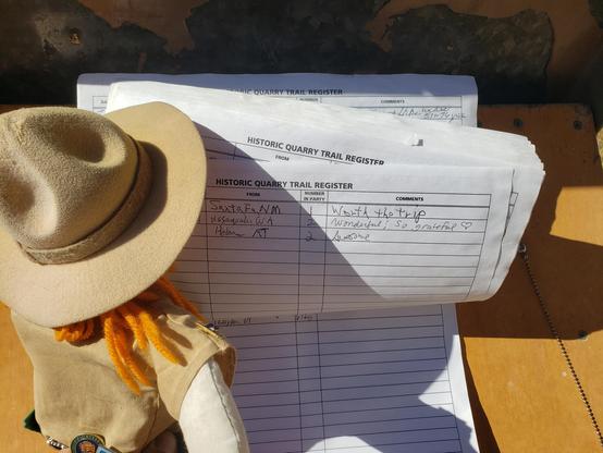 Ranger Sarah signs the trail register at the historic quarry site.
— at Fossil Butte National Monument.
