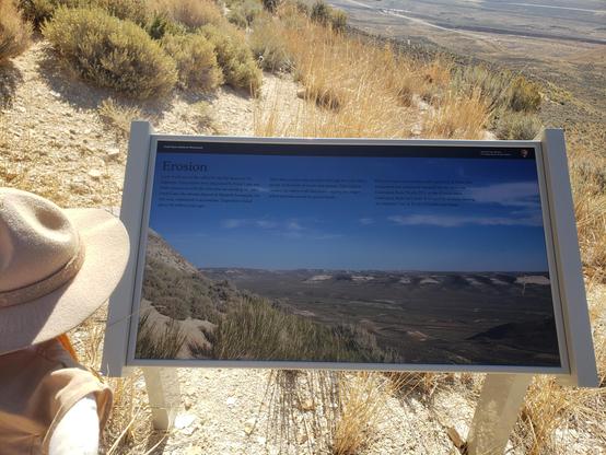 Ranger Sarah learns about the erosion here. Around the valley tan layers on the ridge tops where deposited by Fossil Lake and are at the same level Ranger Sarah is now at. Then the Wasatch Formation deposited the red rock on top. 45 million years of erosion gives us the land we see today.
— at Fossil Butte National Monument.
