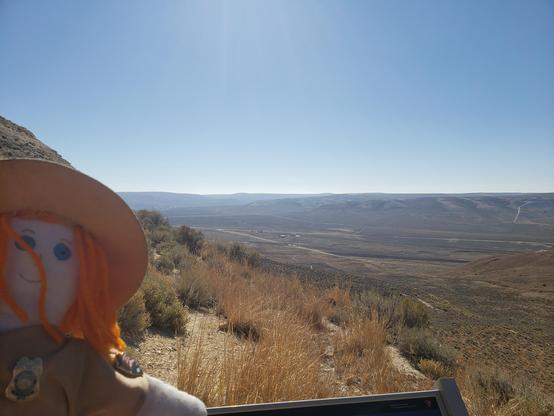 Ranger Sarah looks out across the valley, amazed that those distant ridges represent the same layer in Fossil Lake before 45 million years of erosion went to work.
— at Fossil Butte National Monument.
