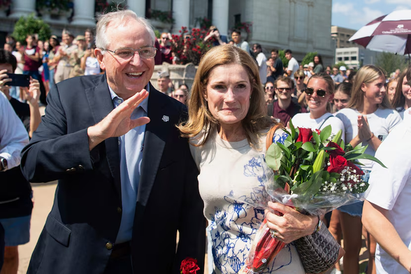 Texas A&M University President Mark Welsh and his wife, Betty Welsh, make their way through the crowd during a sendoff on Texas A&M campus on Friday, Sept. 19, 2025, in College Station, Texas. Welsh resigned after political intrusions into the school's operations, a trend that is making Texas universities not exactly universities, argues Jacob Beck. (Meredith Seaver/College Station Eagle via AP)
Meredith Seaver / AP