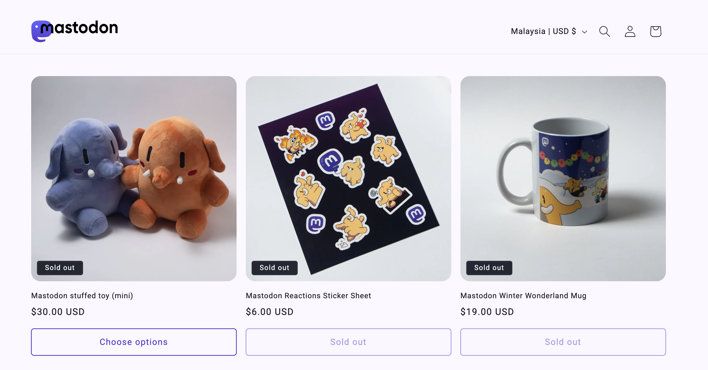 Three merchandise items: plush elephant and dog toys, a sticker sheet, and a winter themed mug, all marked "sold out" on the website.