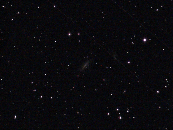 NGC 0672 and IC 1727 Galaxies - unprocessed image.  IC 1727 is an irregular galaxy that shows more distortion and asymmetry than its partner, NGC 0672, due to their interaction.