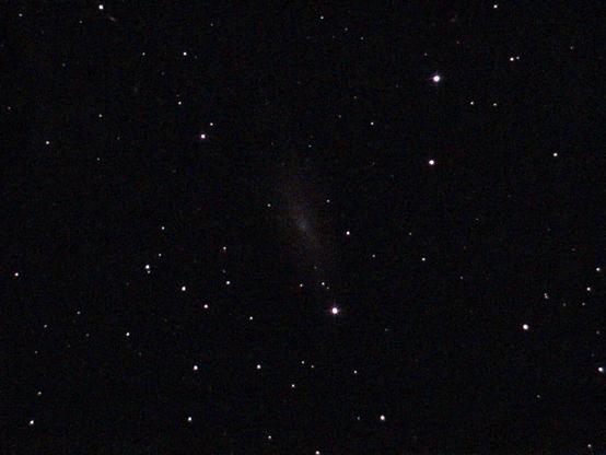 NGC 0247 The Claw Galaxy - unprocessed image.  It has an unusual, large void on one side of its disc, an area with older, redder stars and no younger, blue stars.