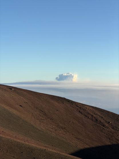Kilauea eruption dust in the distance as seen from Mauna Kea