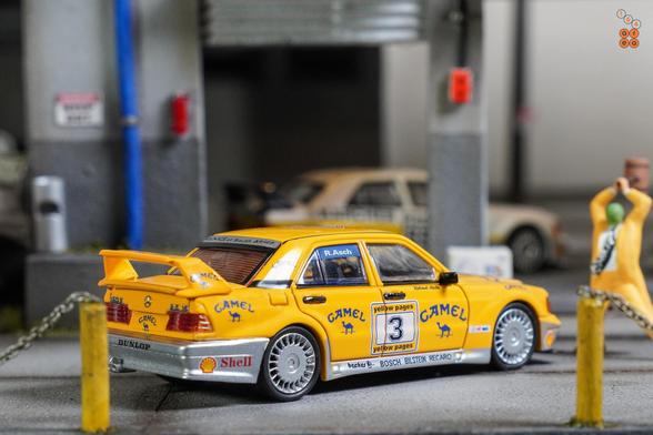 A right side of Mercedes Benz 190E, Camel 1990 Yellow Page livery by LMLF in 1:64 scale with 1:64 figure on AREA 164.