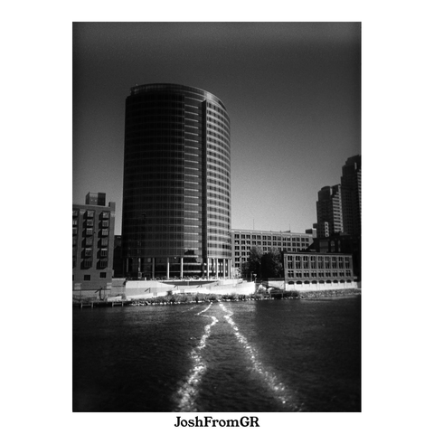 Building with reflection on river