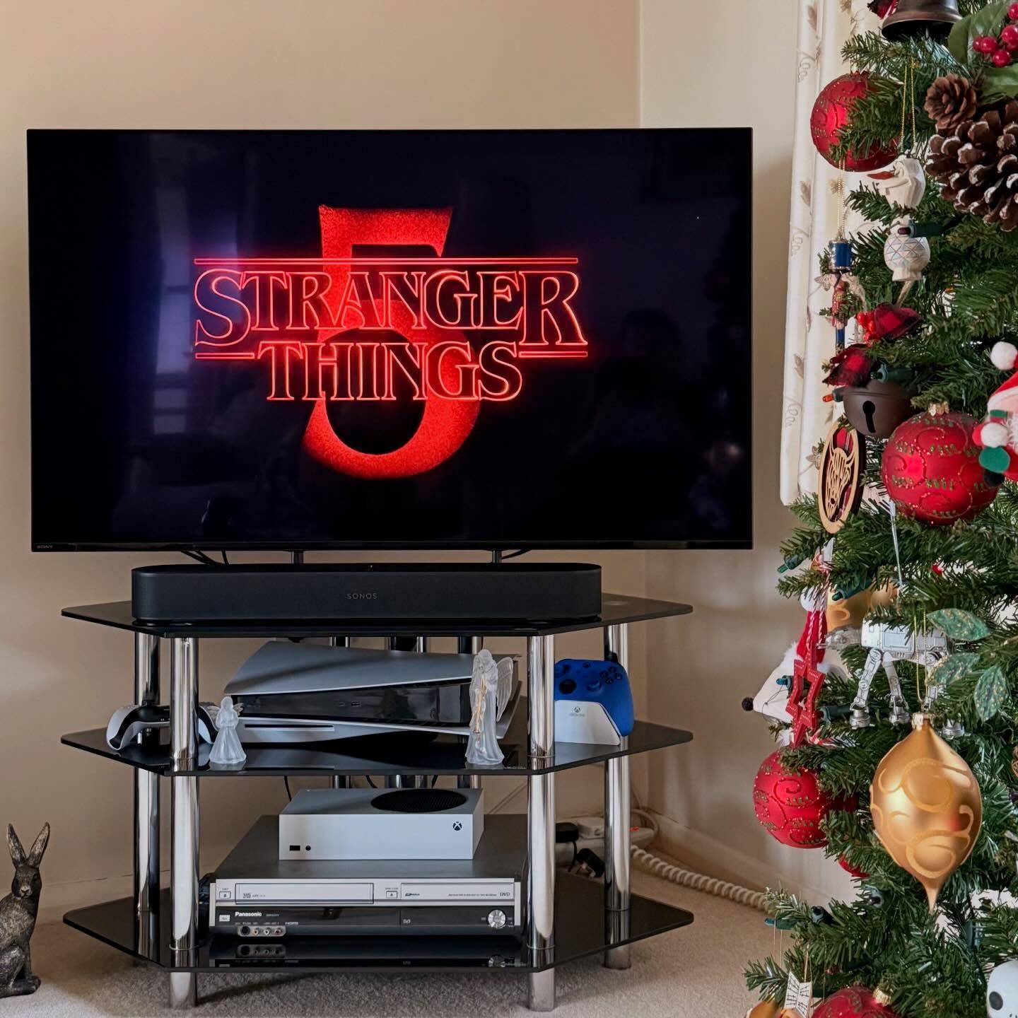 Watching Stranger Things 5 on Netflix with Christmas decorations on the tree!