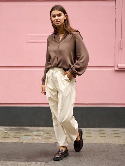 Parachute pants have made a stylish comeback on college campuses. Their loose fit, breathable fabric and easy-going vibe make them ideal for daily campus wear. From neutral tones to bold colours, learn how to mix and match them with crop tops, jackets or traditional kurtis for a modern student aesthetic.
