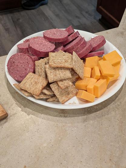 Cheese plate with crackers and summer sausage