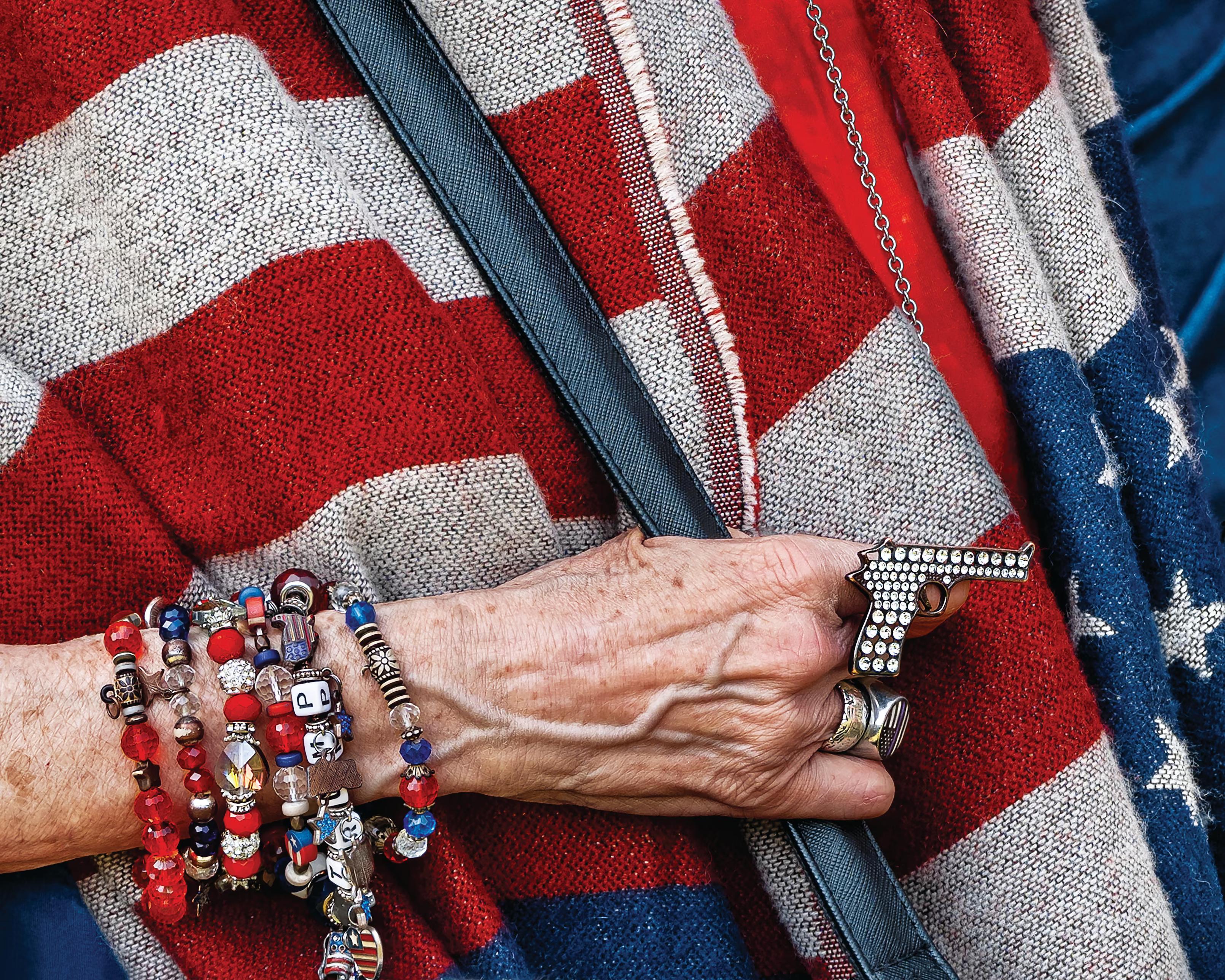 'What first caught my eye was this woman’s hand resting against a flag-patterned shawl, piled with beaded bracelets and a rhinestone pistol ring.'