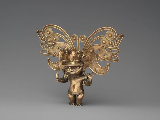 Gold figure pendant
Gold, 13.7 x 16.8 x 5.1 cm, Tairona artist, between 900–1600
The Metropolitan Museum of Art
A chieftain from Colombia is depicted with an elaborate, flamboyant headdress.