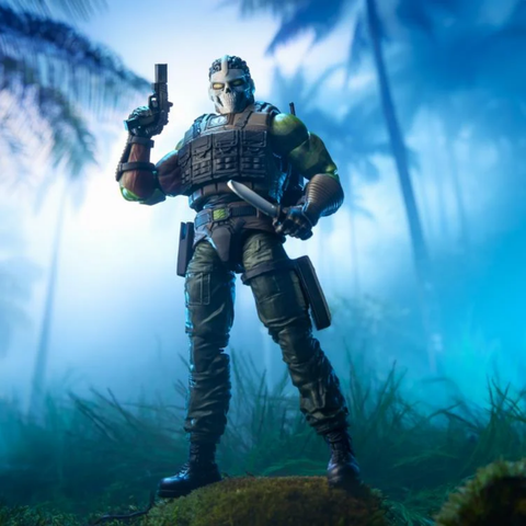 the figure standing on a rock, holding a pistol with the muzzle to the sky, his arm bent at his side, in his other hand holding a large knife, looking down at the viewer from a slightly elevated view, trees and mist behind him 