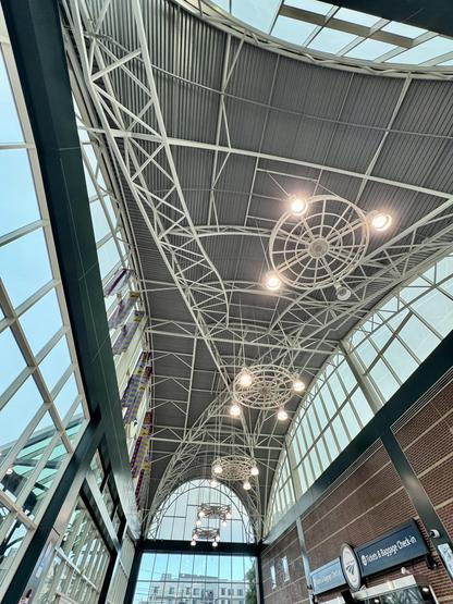 Ceiling and arched windows inside the Oakland, Jack, London Square Amtrak station.