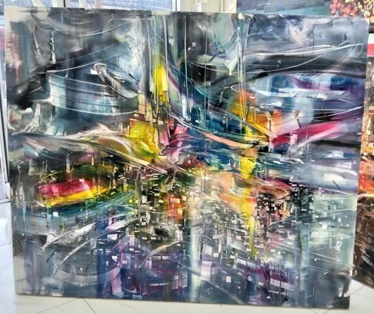 a blurred congested cityscape, whirling energy coming from it in wild bands, blue-tinted mostly, some yellow and red and purple regions 