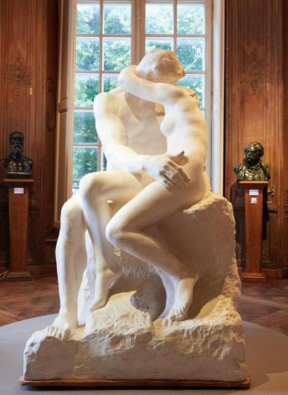 Rodin's Kiss bathed in golden light.
